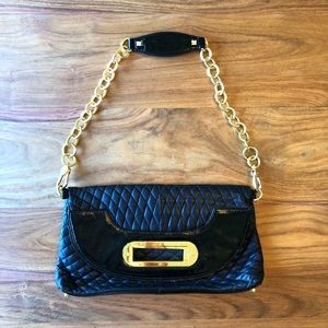 BCBGMaxAzria Black Leather with Gold Chain in Mint Condition